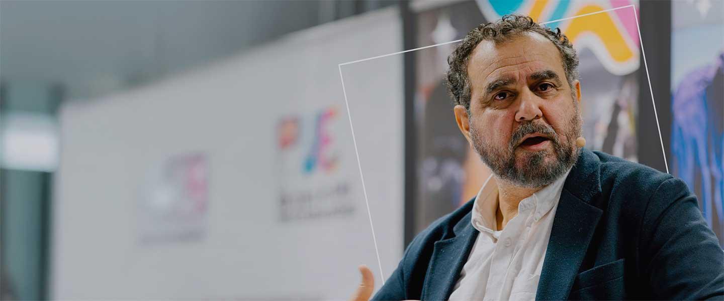 Josep Ballesté speaking during a conference session, addressing the audience with a professional and engaging tone.